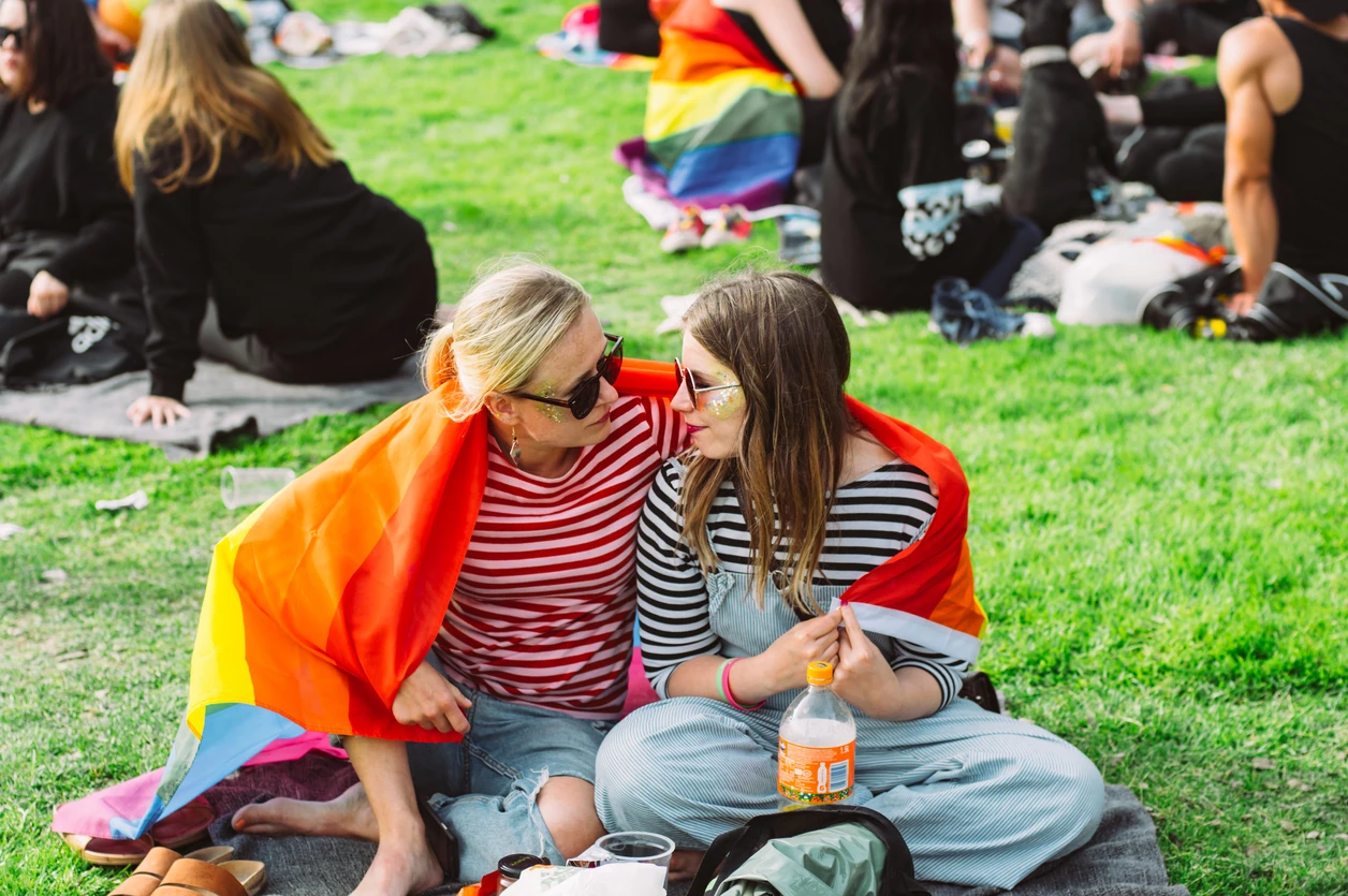 Two girls on picnic in public park