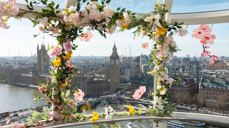 A view of Big Ben from the London Eye with flowers on the window