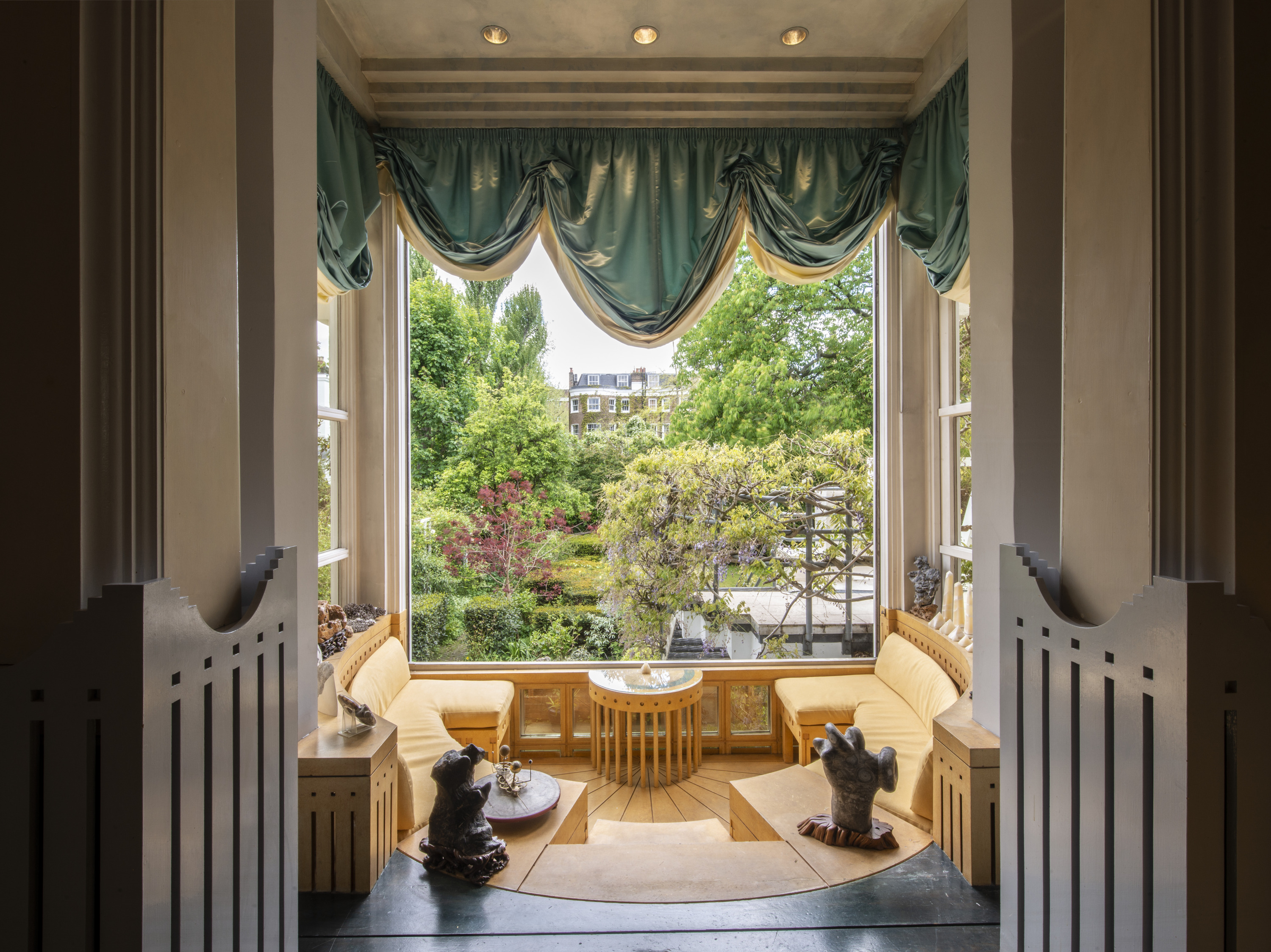 The Sundial Room faces south over the garden the room with radial seating around a sundial. 