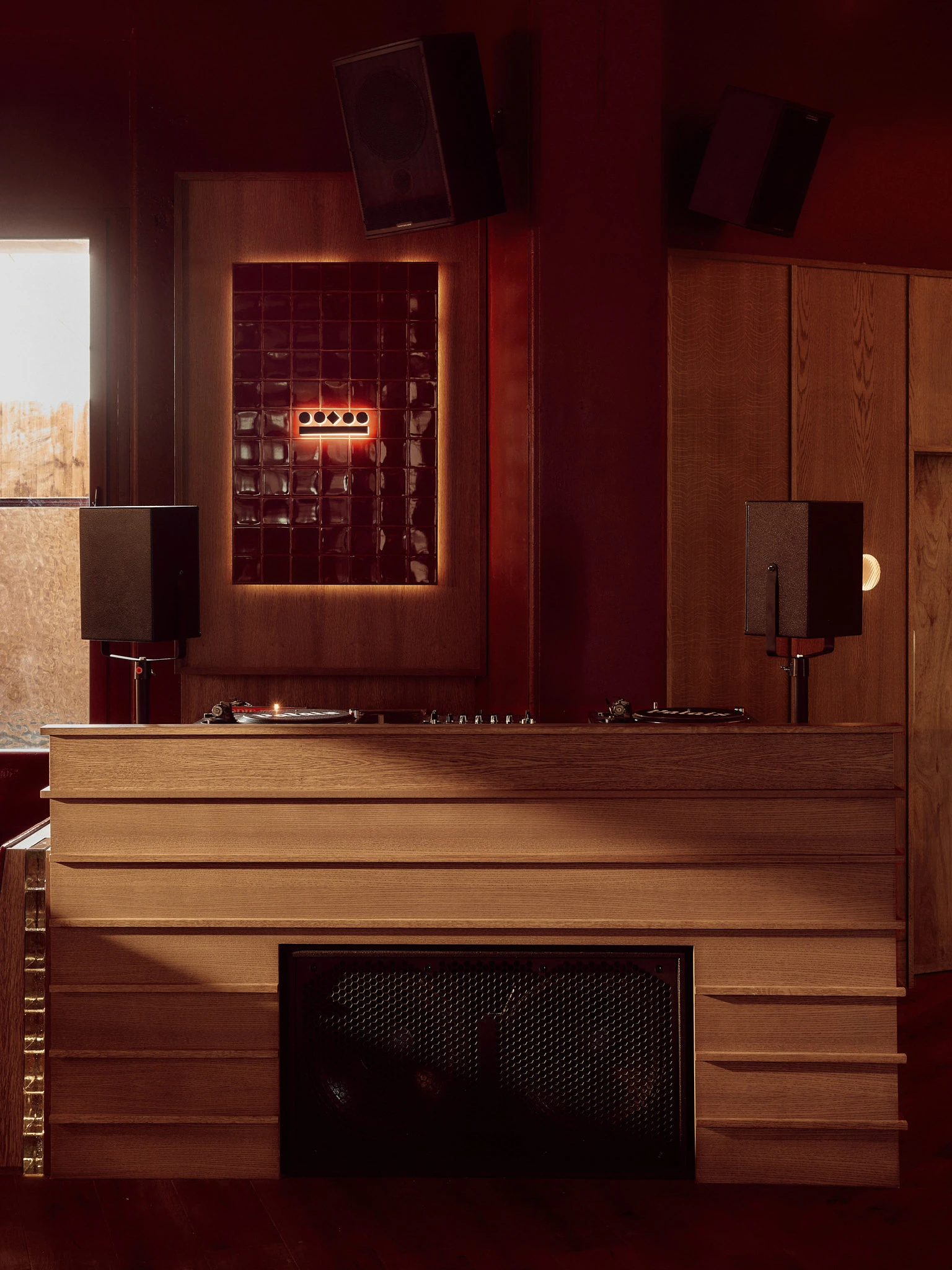 DJ booth with speakers and vinyl record decks