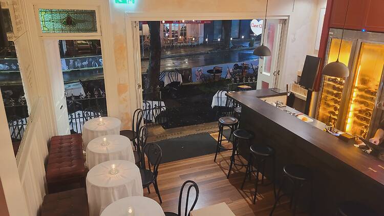 Looking down at a wine bar from the stairs