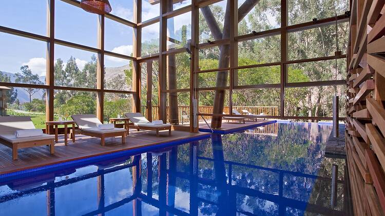 A pool inside a glass wall