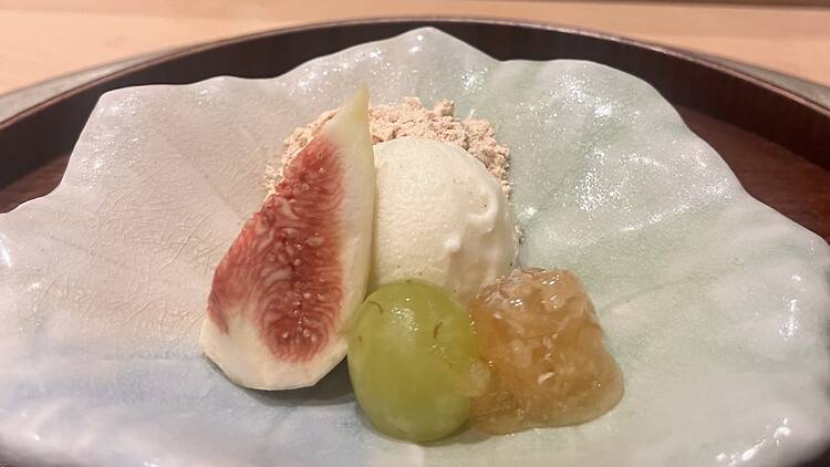 A plate of fruit and ice cream at Matsu.