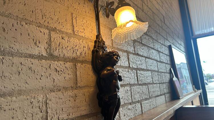 Cherub wall sconce at Times New Roman.