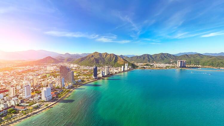 North beach overlooking aerial view city on the gold main resort coast of Southeast Asia in the hot sunny day Nha Trang.
