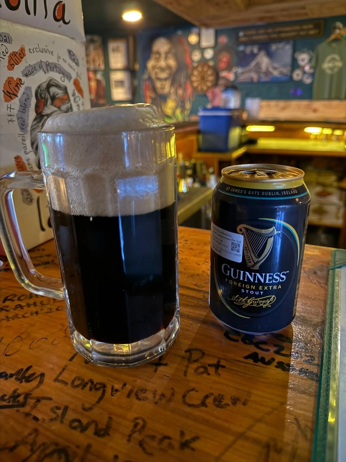 A pint of Guinness and the can it came from in the world&rsquo;s highest Irish pub