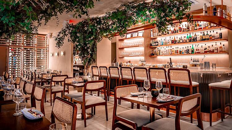 Inside of Frena with vines and a soft pink glow