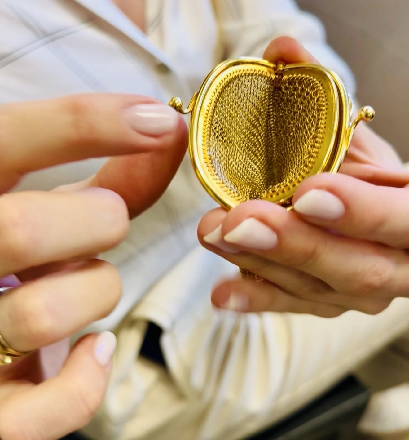 A delicate, handmade coin purse.  