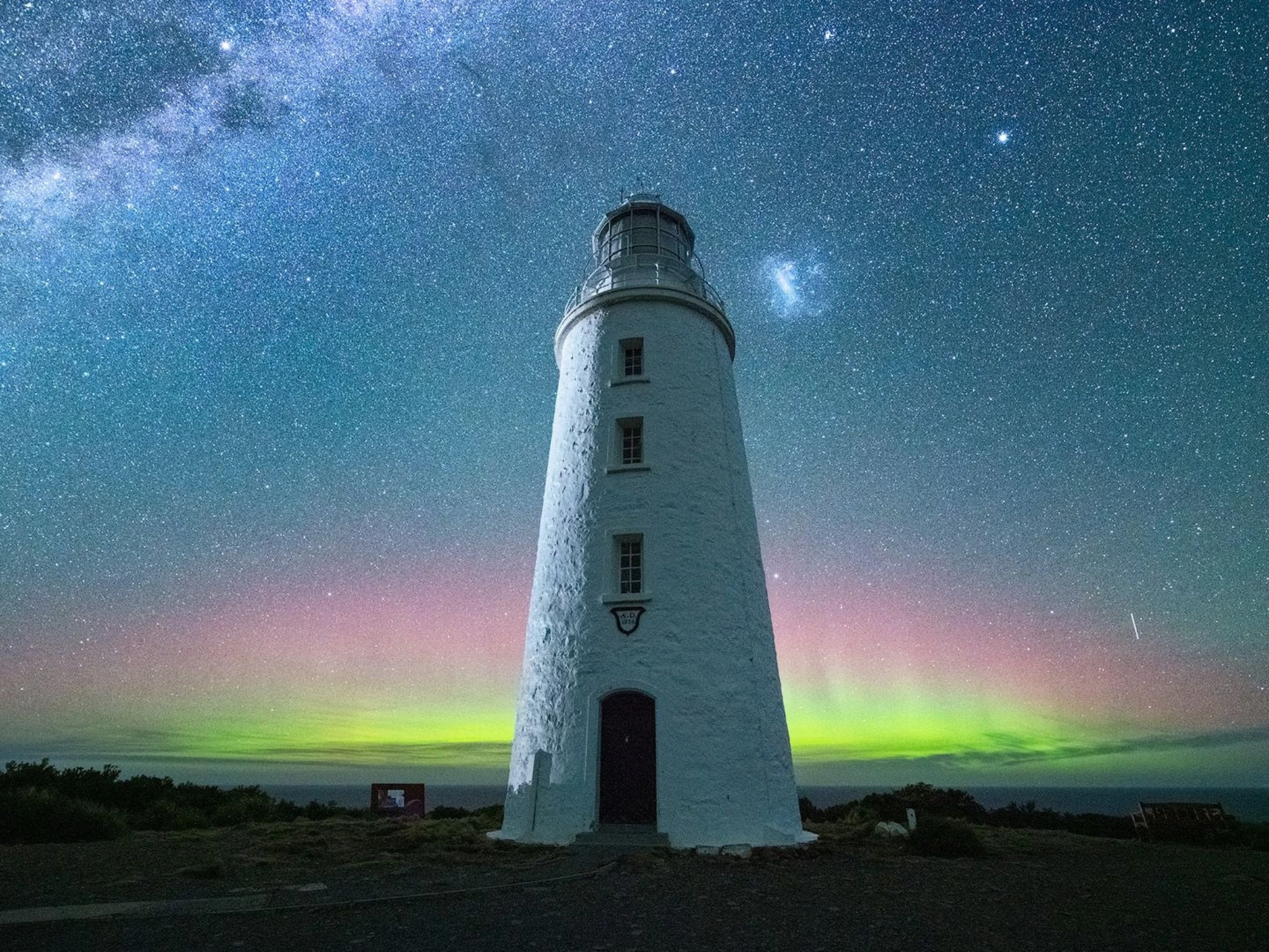 Lighthouse under stars