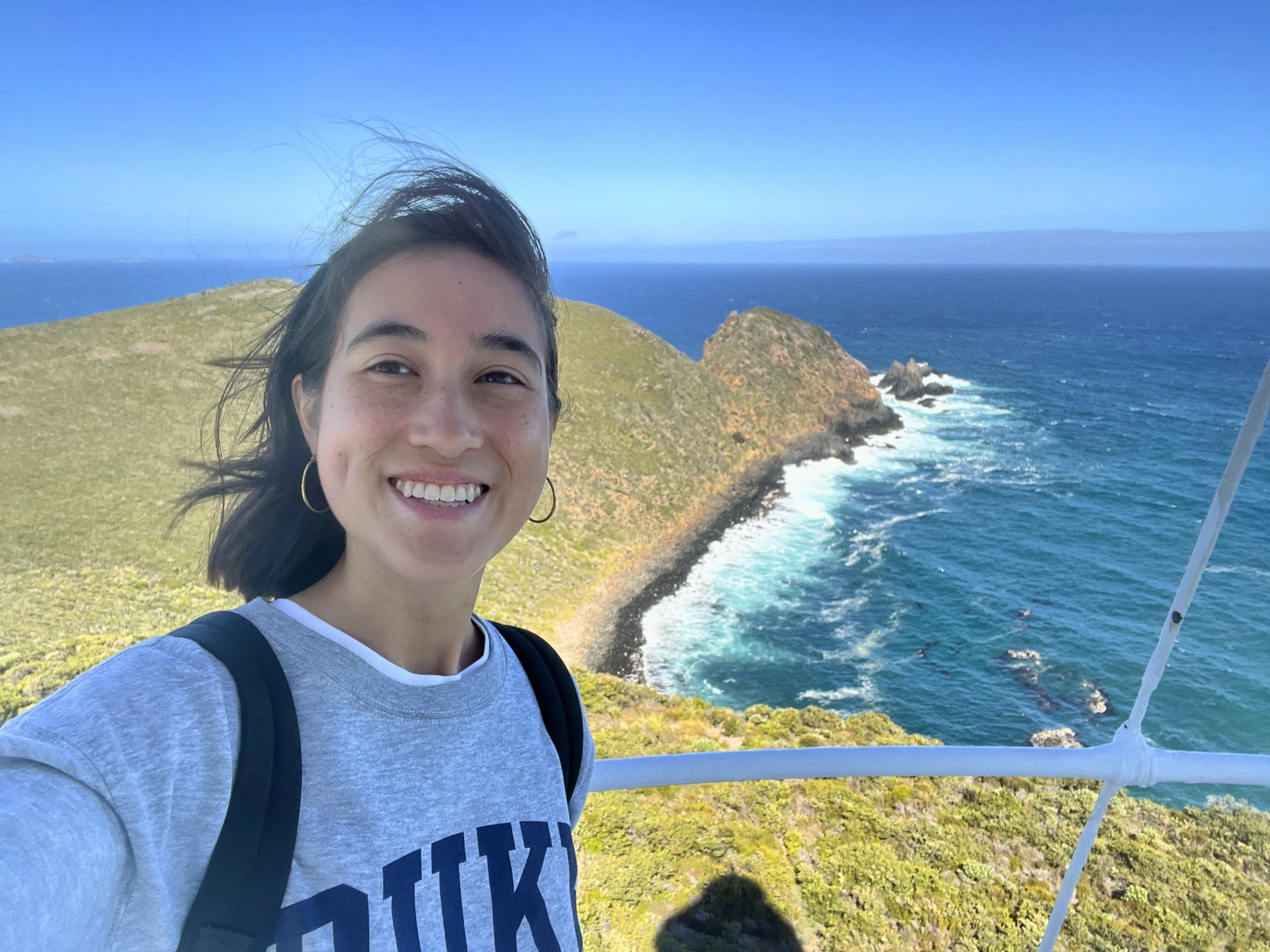Girl smiling overlooking water