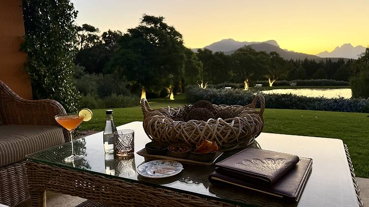 Pre-dinner drinks at sunset overlooking the pond at La Residence. 