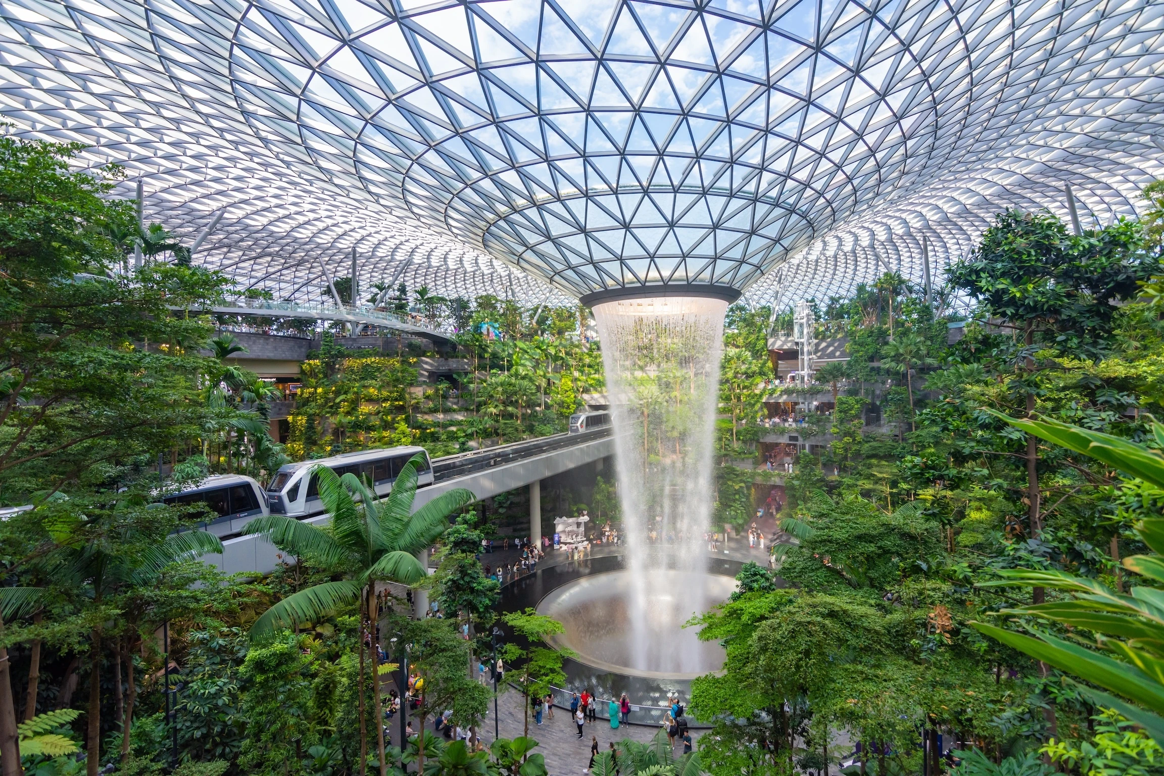 Singapore - Apr 9, 2023: Jewel Changi Airport is building is filled with attractions, indoor waterfall and tropical forest, shopping malls and dining area. The Vortex is the largest indoor waterfall