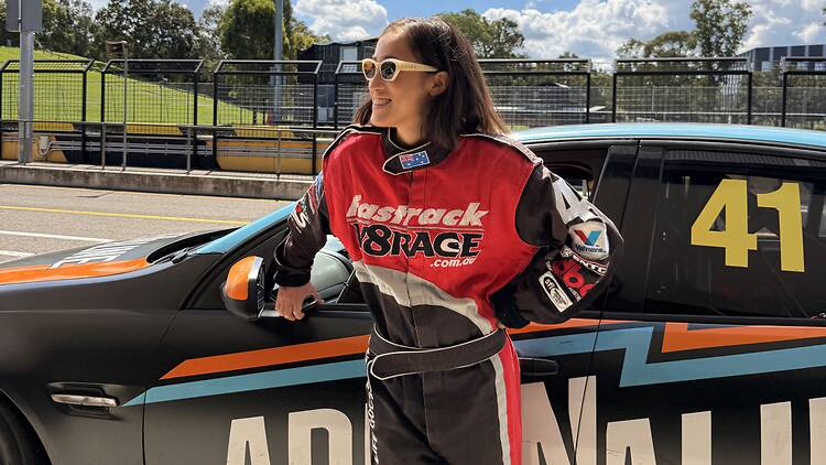Girl in front of race car