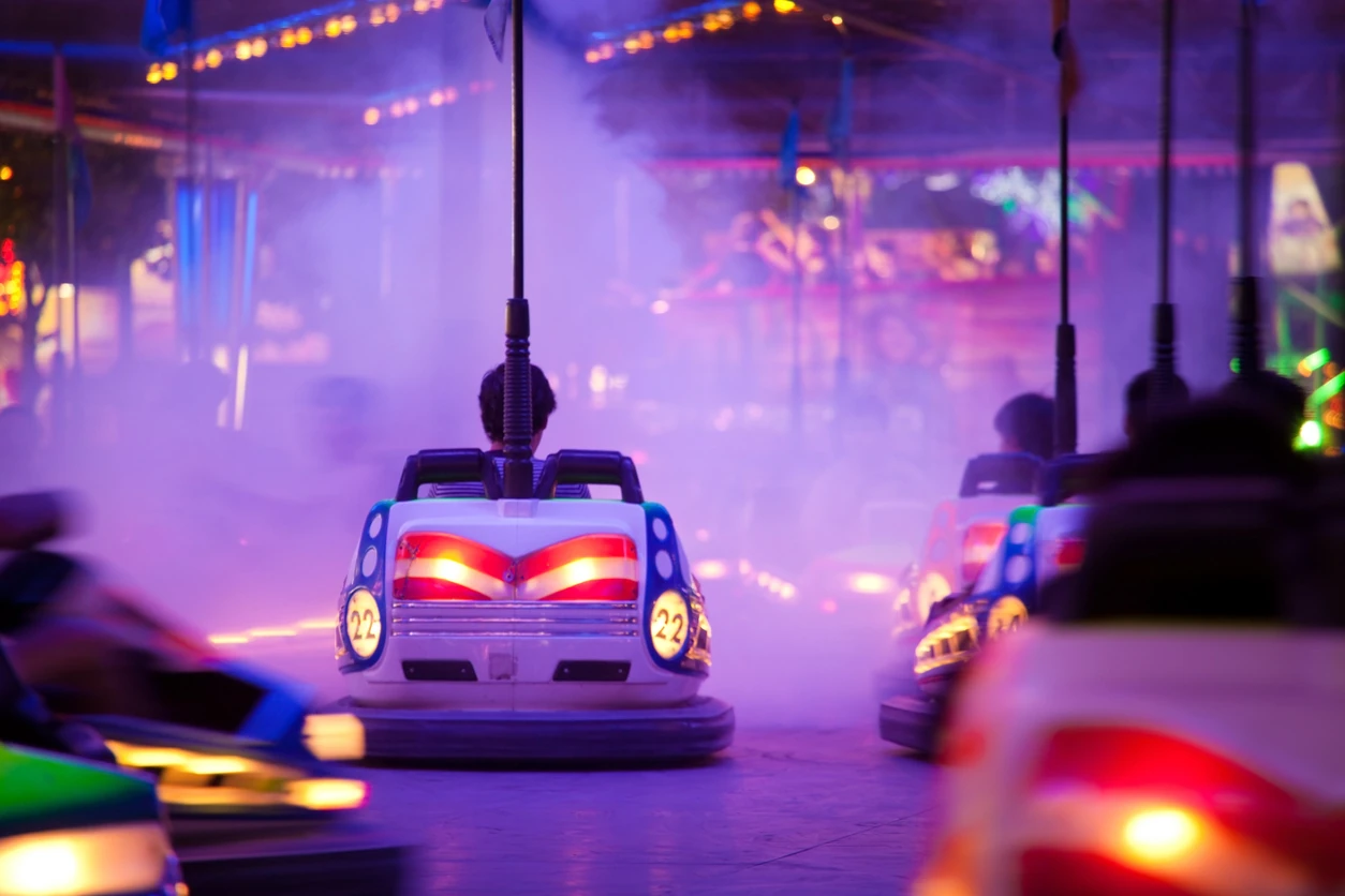 Unrecognizable people driving through artificial smoke. Soft focus and motion blur on cars. 