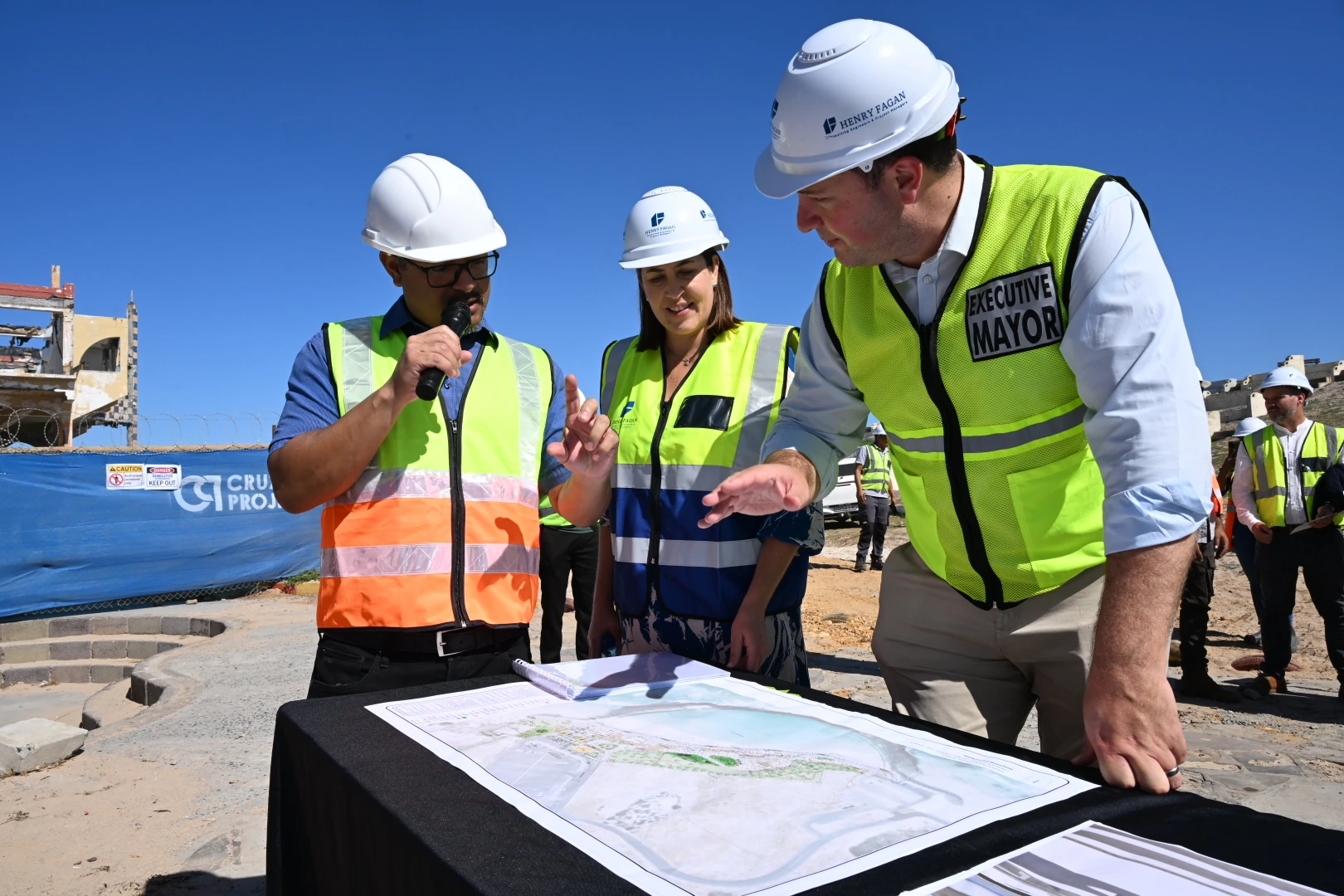 Mayor Hill-Lewis and Councillor Higham are briefed on the construction plan by the project manager.