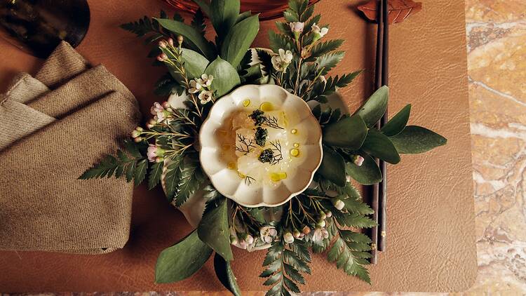 A fish dish on a bed of flowers