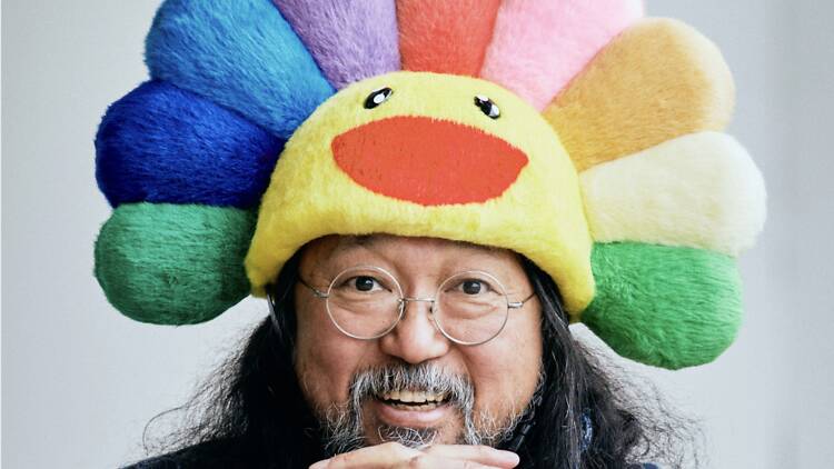 Japanese artist Takashi Murakami Japanese artist Takashi Murakami wearing a colourful bird headpiece