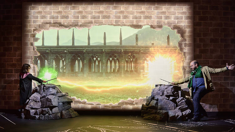 people with wands at Harry Potter: The Exhibition