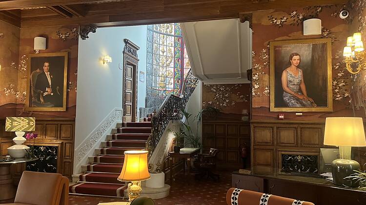 The atrium and concierge desk at Hospes Infante Sagres Porto