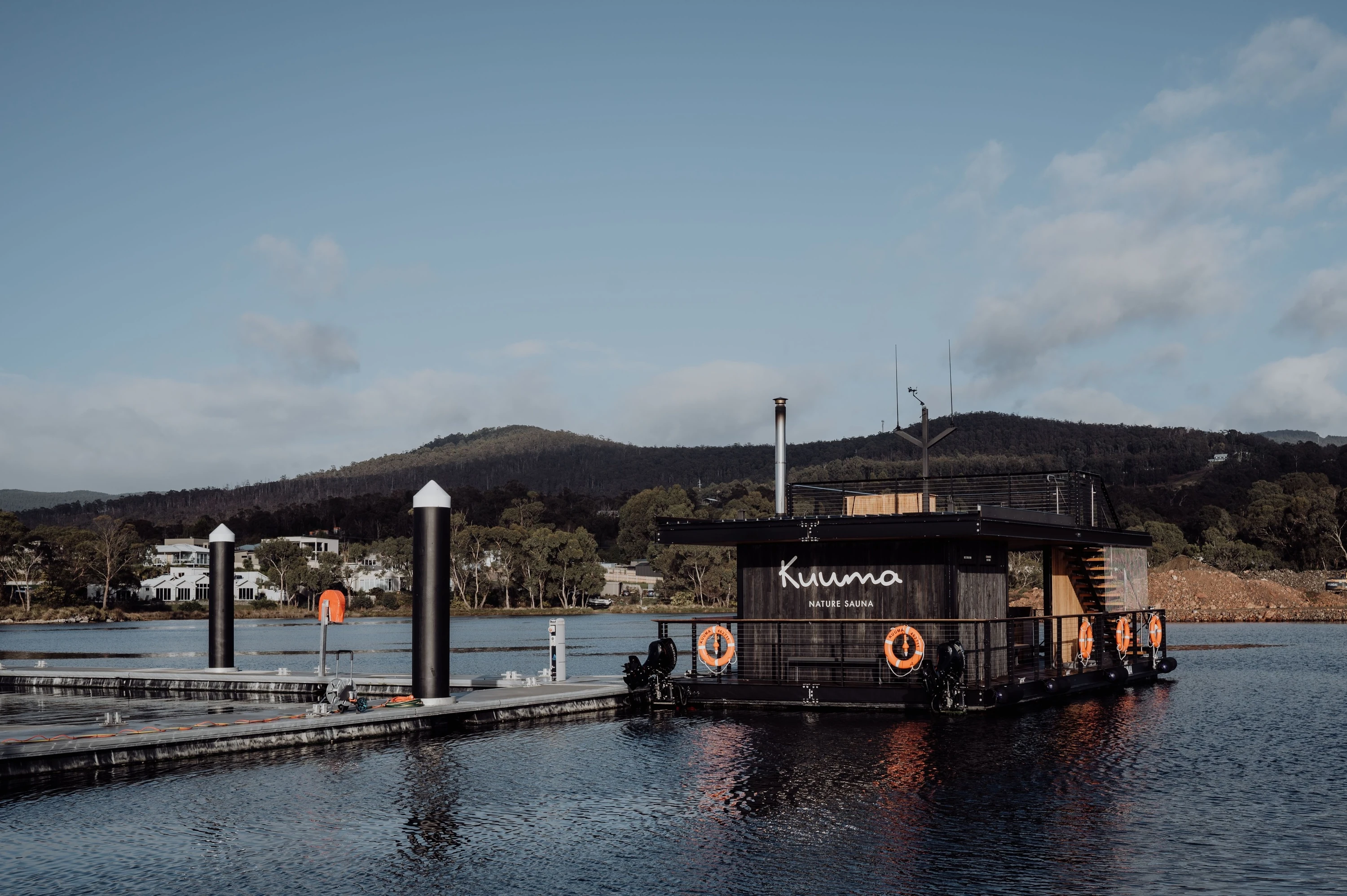 Floating sauna boat on water