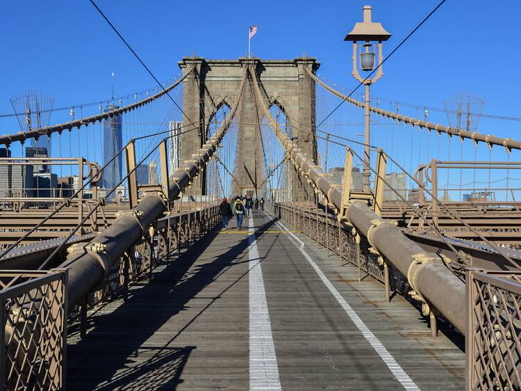 The city is planning to upgrade the Manhattan side of the Brooklyn Bridge entrance by June, building separate bike and pedestrian entrances
