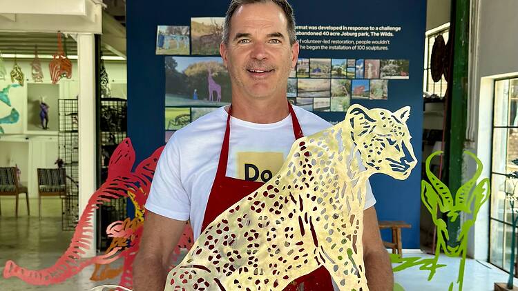 James Delaney holding his art work