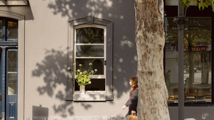 A person walking past Cordelia.