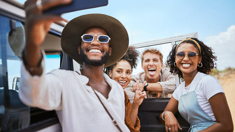 1445251069 Phone selfie, friendship and car road trip or nature safari holiday travel in Africa together happy for adventure. Mobile photography of excited men, women or young group of people on summer vacation