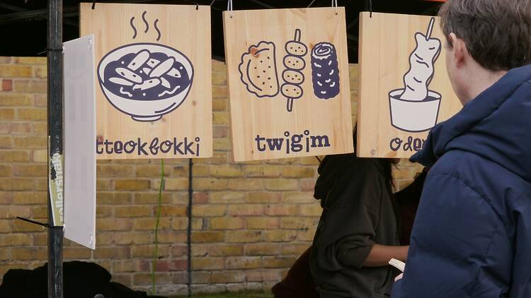 Signs on Korean food stall at market