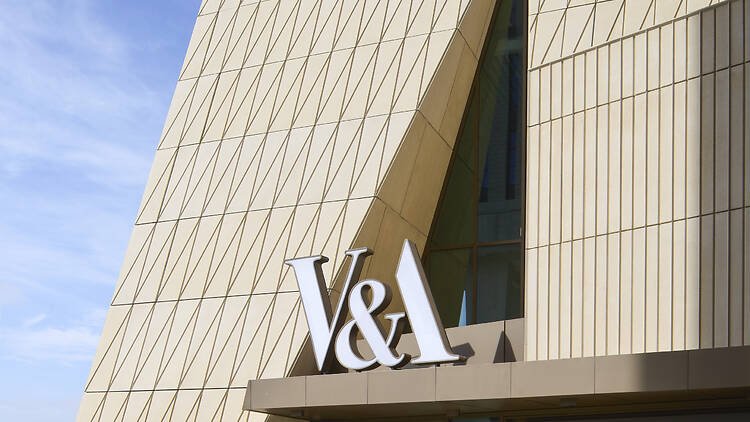 Entrance to new V&A East Museum with V&A sign and slanted wall