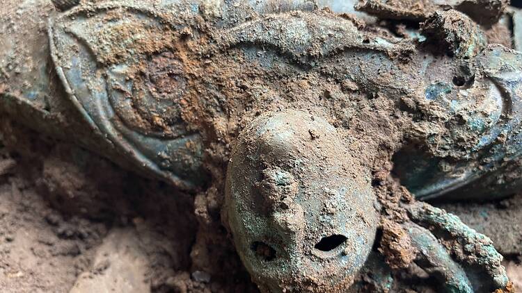 Mask carved into the bottom of a cauldron found at the Yorkshire excavation site
