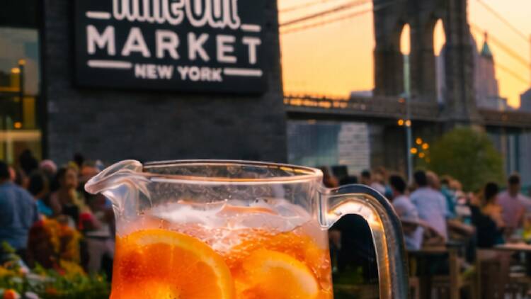 A picture of a spritz with the Time Out Market building behind it