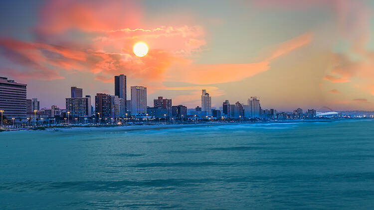 Durban city skyline from ocean with illuminated beach front buildings