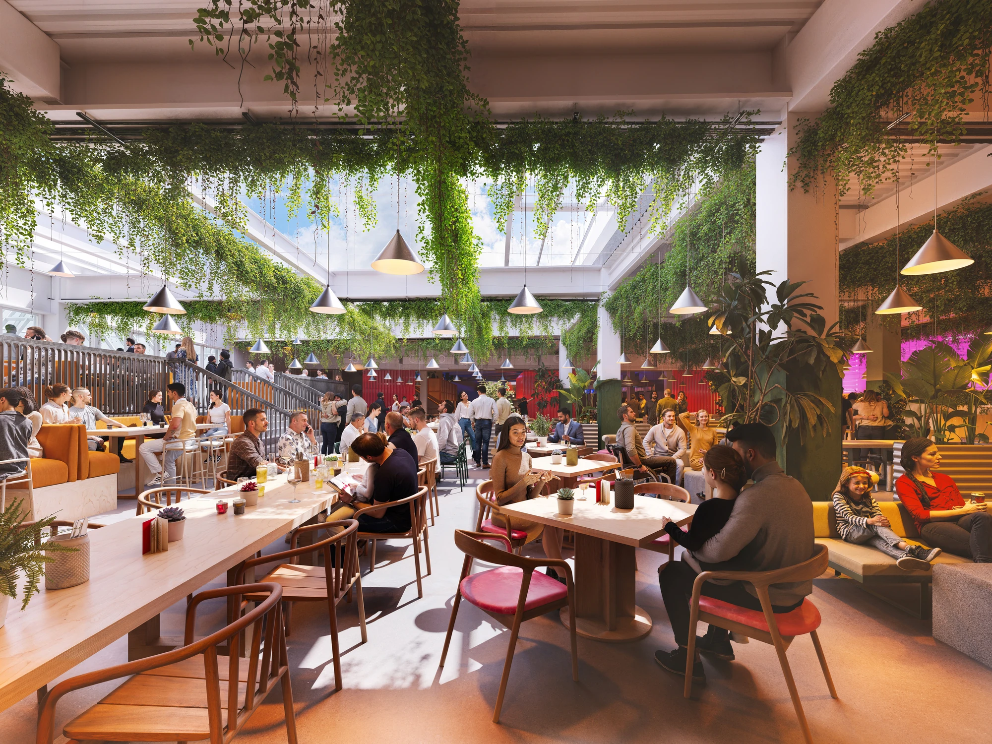 Large dining space with people sitting at various tables under retractable roof