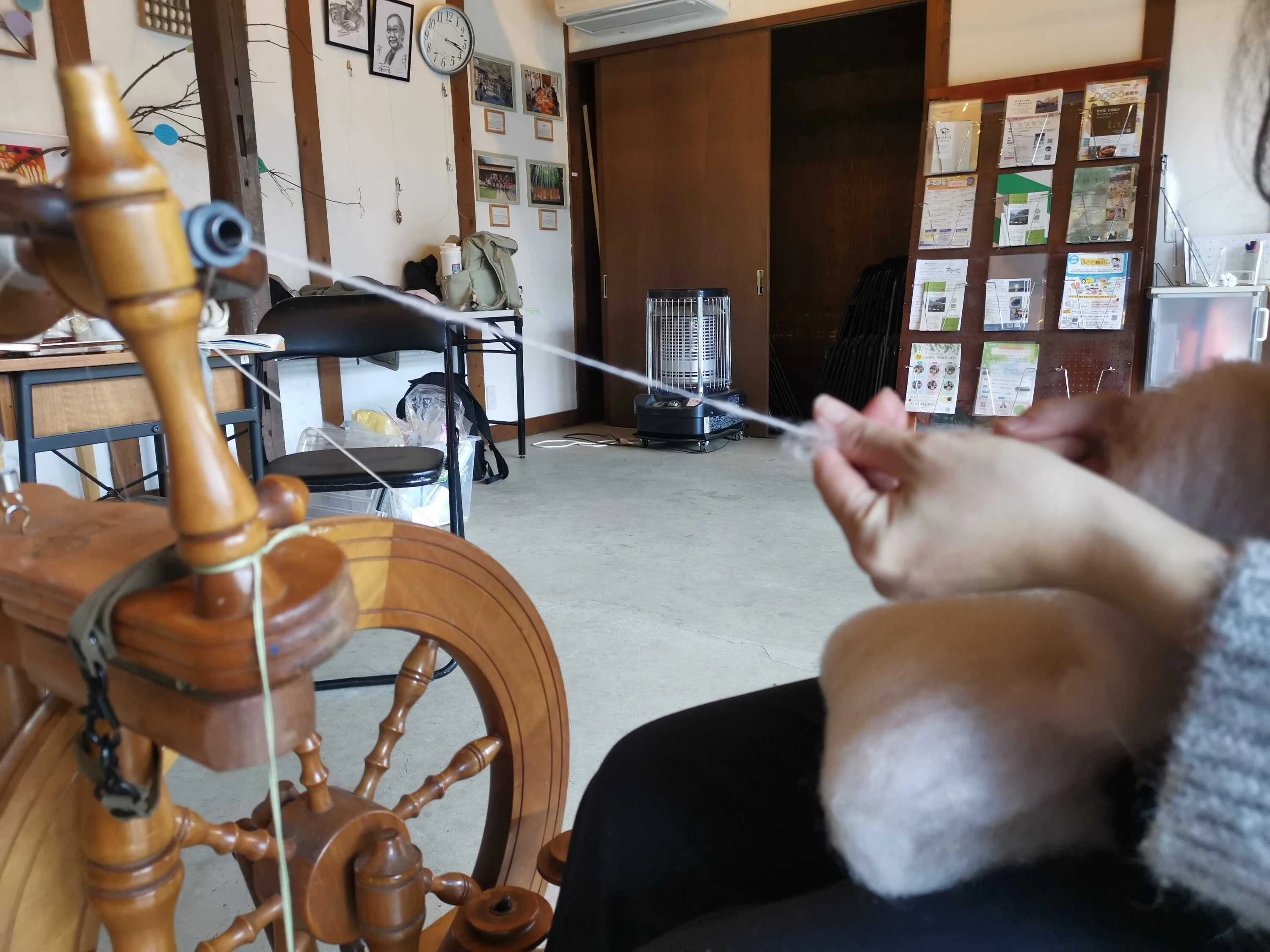 Tour participant using spinning wheel