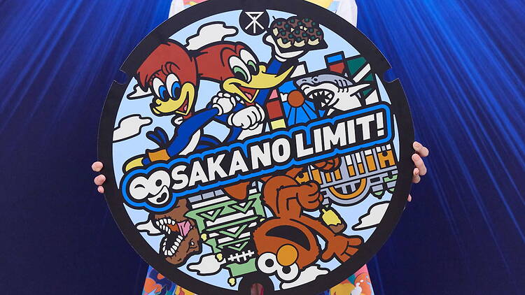 USJ manhole cover featuring Elmo, Woody and Winnie Woodpecker