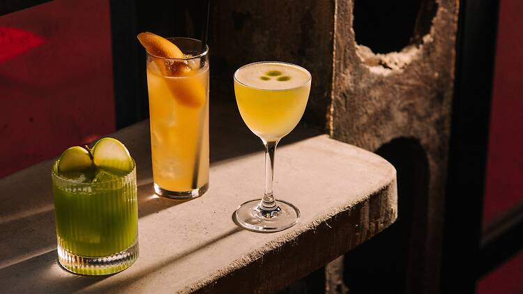 Three drinks on a concrete bar