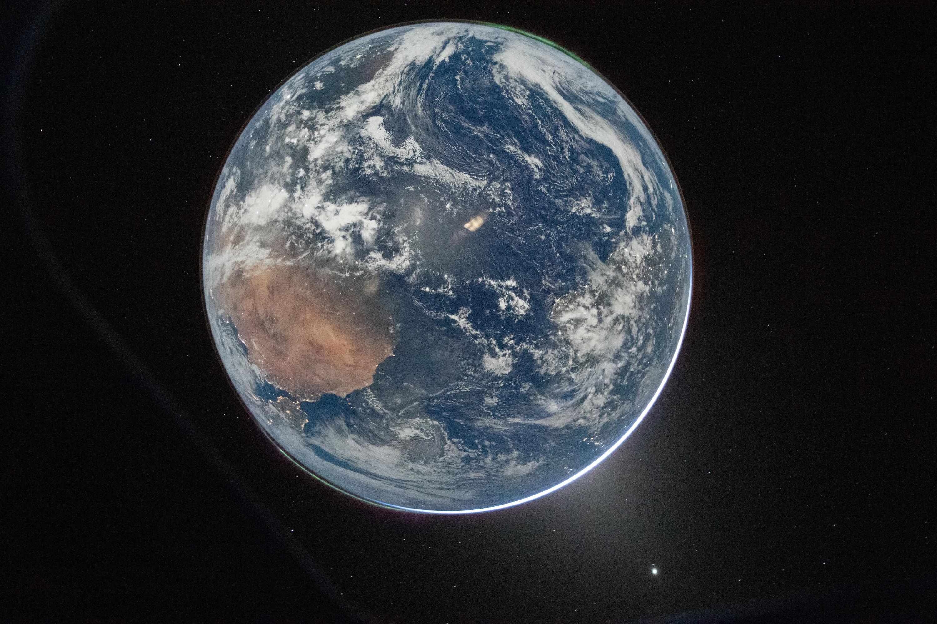 A picture of Earth from the Orion spacecraft's window on April 2, 2026, after completing the translunar injection burn.