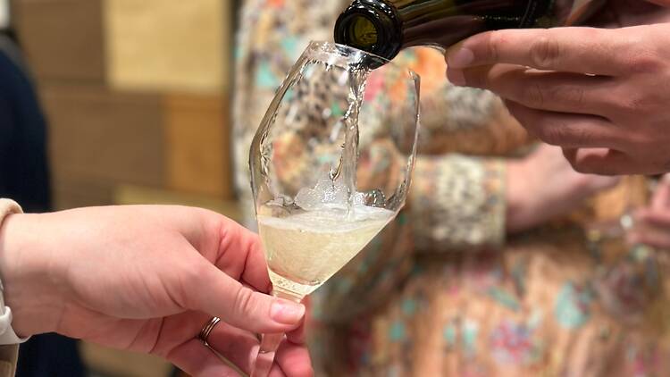 pouring sparkling wine into a glass