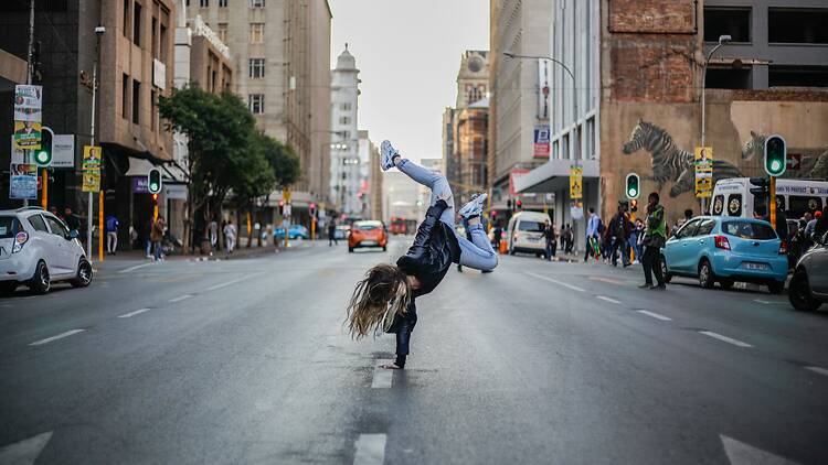 Johannesburg hand stand in the street
