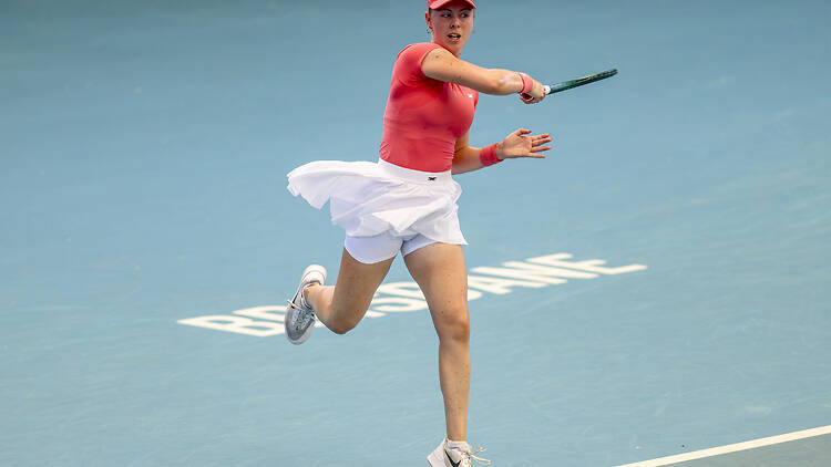 A female tennis player on court