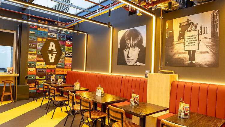 Tables and wall displays in the refurbished Hacienda-style Amber Alehouse Tables and wall displays in the refurbished Hacienda-style Amber Alehouse