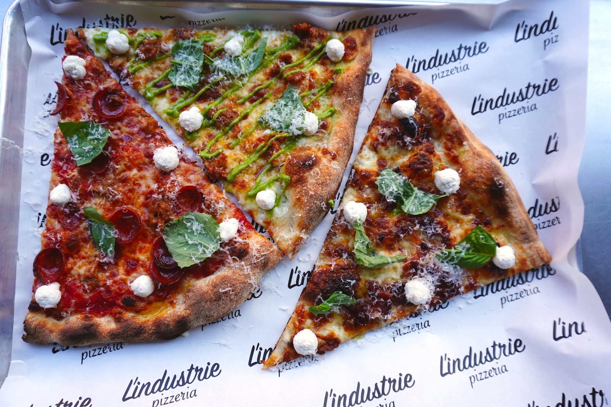 L'Industrie's excellent Burrata slices have officially landed in Little Italy