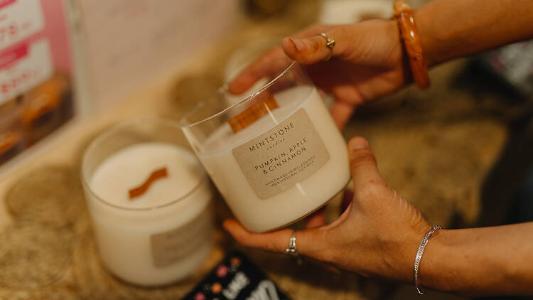 A woman looking at a candle