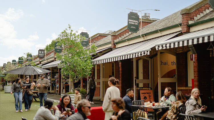 An open-air market with stalls and seating