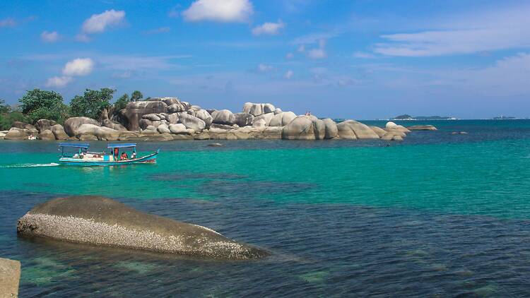 Boat in water on island