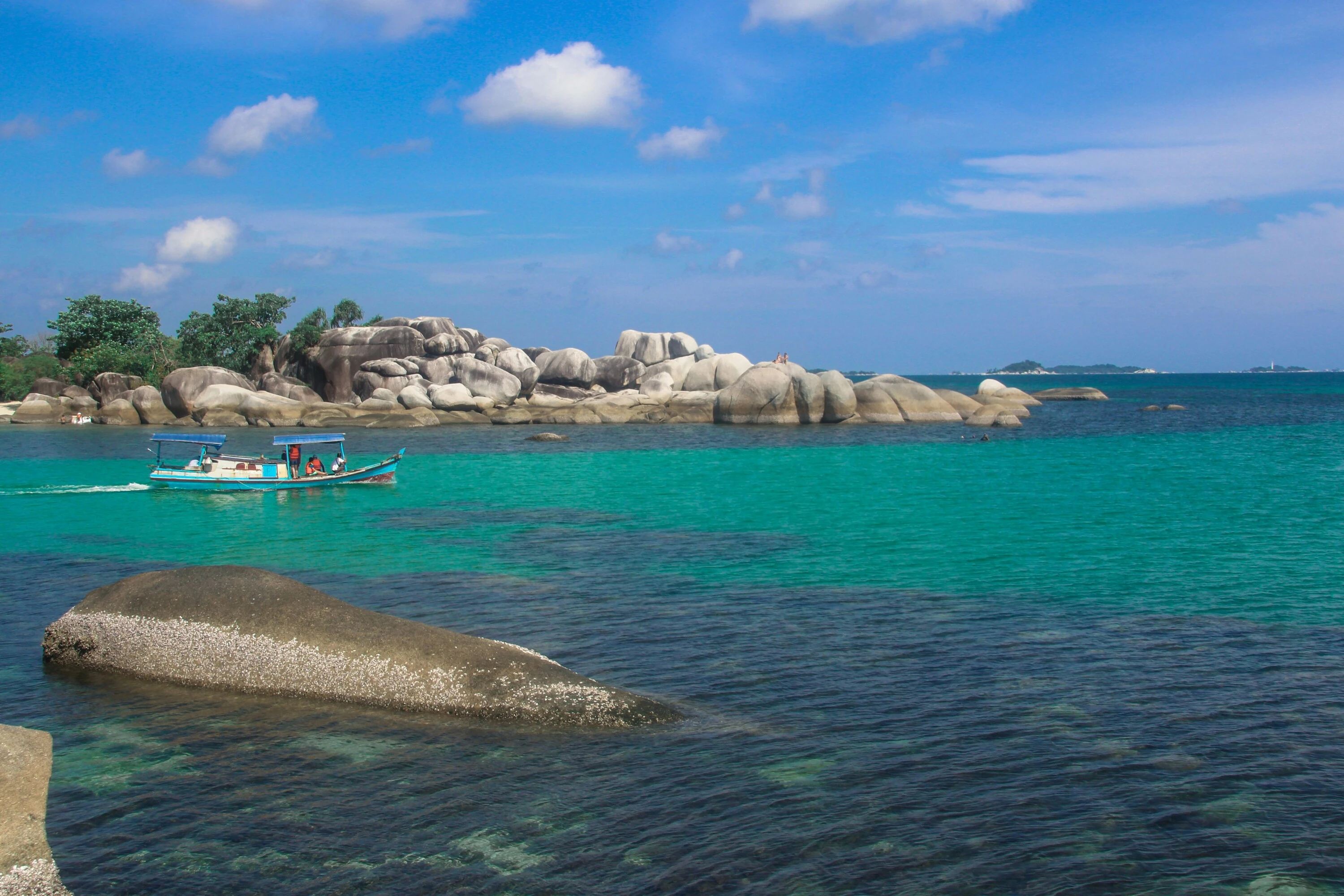 Boat in water on island