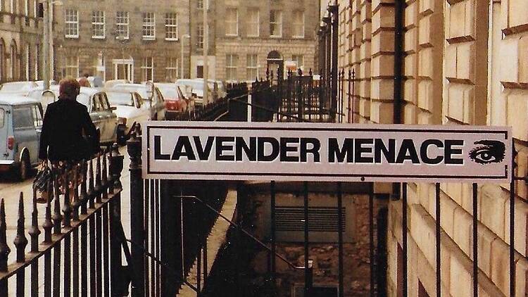 Lavender Menace sign on railing in Edinburgh, Scotland