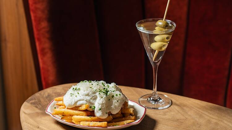 A plate of fries and a martini