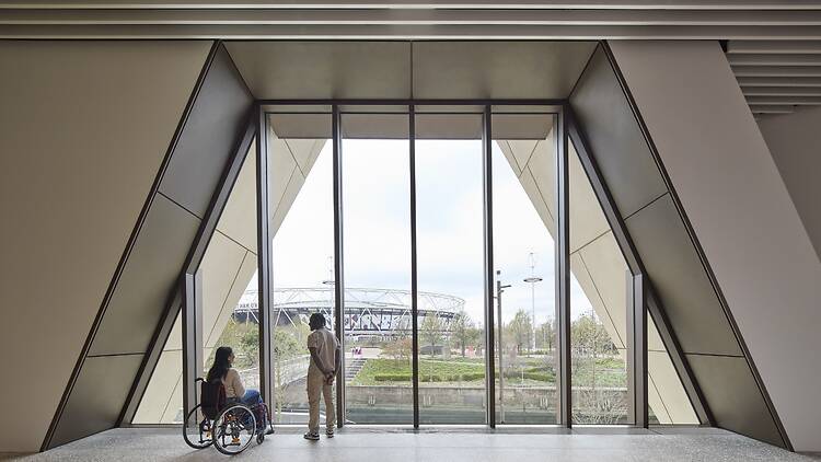 Large triangular window view a view of West Ham’s London Stadium in Stratford